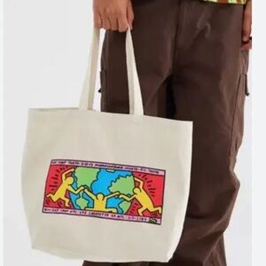 NWOT Urban Outfitters Keith Haring Globe Tote Bag in a Cream Canvas.